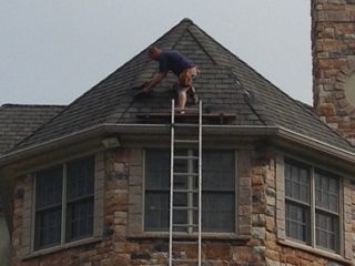 Installing shingles on roof peak